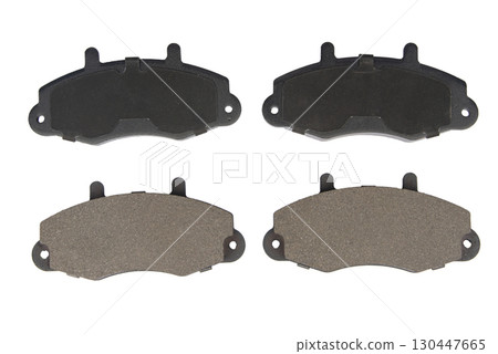 Auto brake pads isolated on white background. Set of brake pads. New auto spare parts isolated on white background Auto brake pads isolated on white background. Set of brake pads. New auto spare parts isolated on white background 130447665