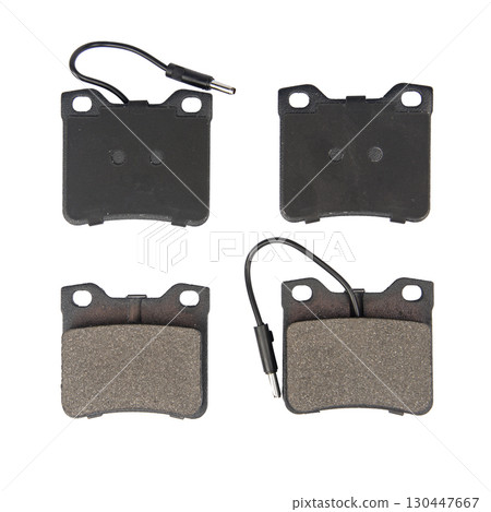 Auto brake pads isolated on white background. Set of brake pads. New auto spare parts isolated on white background 130447667