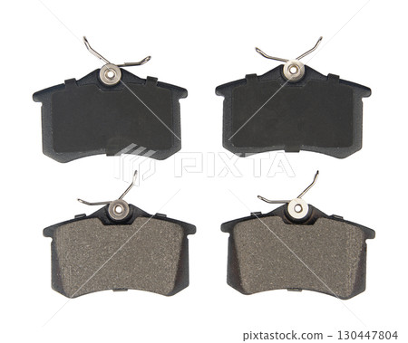 Auto brake pads isolated on white background. Set of brake pads. New auto spare parts isolated on white background Auto brake pads isolated on white background. Set of brake pads. New auto spare parts isolated on white background 130447804
