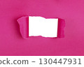 Hole in paper color background damaged ripped 130447931