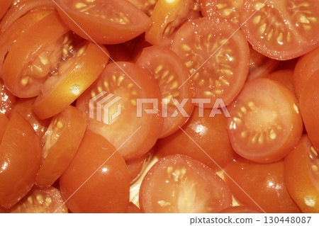 Close up of lots of chopped baby cherry tomatoes for background Close up of lots of chopped baby cherry tomatoes for background 130448087