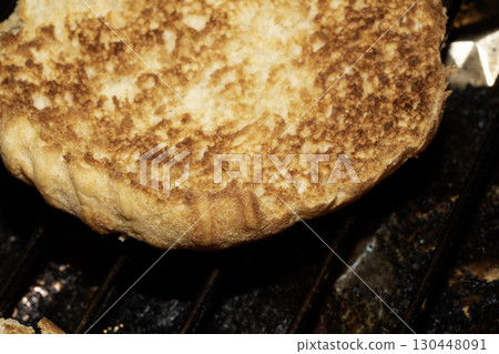 Close up of toasted burger bun being grilled Close up of toasted burger bun being grilled 130448091