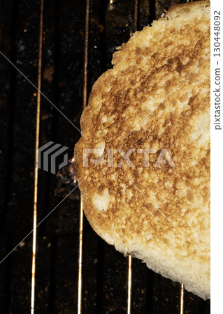 Close up of toasted burger bun being grilled Close up of toasted burger bun being grilled 130448092