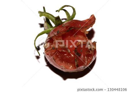 Very mouldy and squashed tomato spoiled and decomposing on white background 130448106