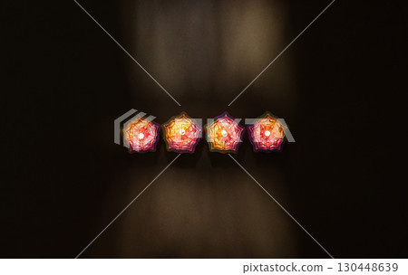 Three Diwali Candles on a Dark Background 130448639