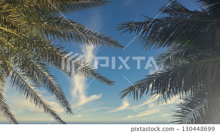 Palm trees frame a serene blue sky with scattered clouds over a tranquil ocean view Palm trees frame a serene blue sky with scattered clouds over a tranquil ocean view 130448699