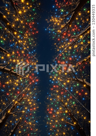 Christmas tree lights looking up at a winter avenue 130449335
