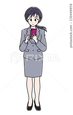 An office lady in a suit operating a smartphone (full body) An office lady in a suit operating a smartphone (full body) 130449958