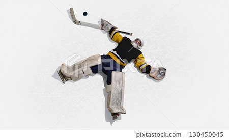 Aerial perspective hockey goalie stretched across ice stopping puck with focus 130450045