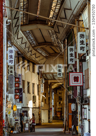 A retro shopping street and people in Gifu City 130450780