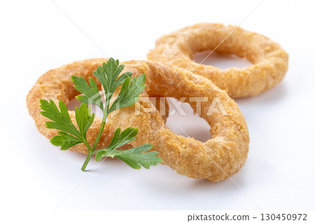 Crispy fried squid rings isolated on white background 130450972