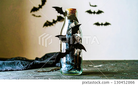 Old glass bottle with miniature haunted house and bats flying around, mysterious Halloween spellbound decoration Old glass bottle with miniature haunted house and bats flying around, mysterious Halloween spellbound decoration 130452866