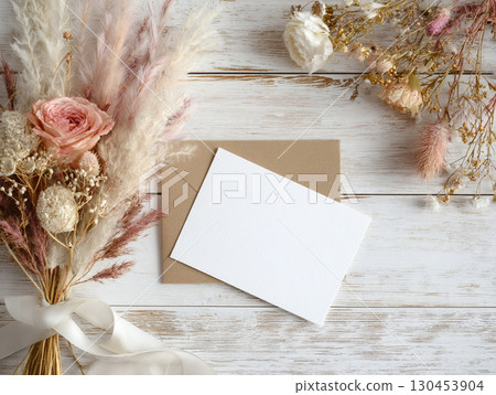 flat lay with a blank card and kraft envelope flat lay with a blank card and kraft envelope 130453904