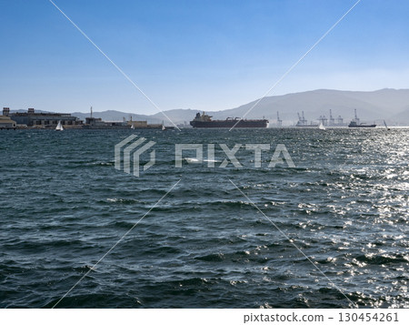 Cargo ships are anchored up in the bay of Algeciras 130454261