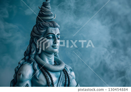 Serene lord Shiva statue posing on a smoky background, representing spirituality and divinity in Hinduism 130454884