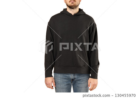 Casual black hoodie worn by a man with jeans, on white background Casual black hoodie worn by a man with jeans, on white background 130455970