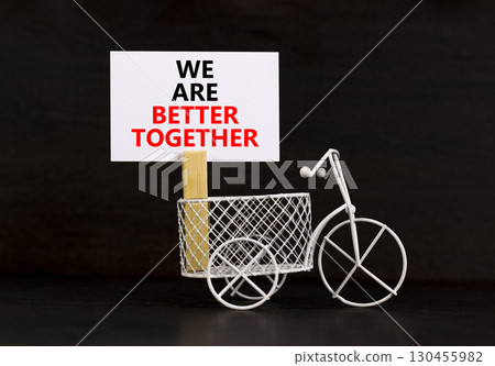We are better together symbol. Concept words phrase We are better together on beautiful white paper on clothespin. Beautiful black background. Business We are better together concept. Copy space. We are better together symbol. Concept words phrase We are better together on beautiful white paper on clothespin. Beautiful black background. Business We are better together concept. Copy space. 130455982