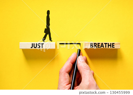 Just breathe and psychological symbol. Concept words Just breathe on beautiful wooden block. Beautiful yellow table yellow background. Business psychological and Just breathe concept. Copy space 130455999
