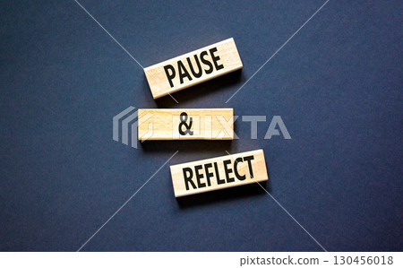 Pause and reflect symbol. Concept words Pause and reflect on beautiful block. Beautiful black table black background. Business motivational lifestyle pause and reflect concept. Copy space. 130456018