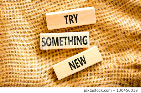 Try something new symbol. Concept words Try something new on beautiful block. Beautiful canvas table canvas background. Business motivational lifestyle try something new concept. Copy space. Try something new symbol. Concept words Try something new on beautiful block. Beautiful canvas table canvas background. Business motivational lifestyle try something new concept. Copy space. 130456019