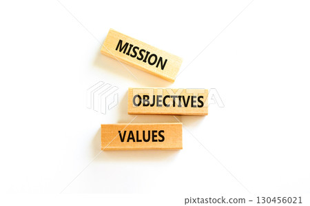 Mission objectives values symbol. Concept words Mission Objectives Values on beautiful blocks. Beautiful white table white background. Business mission objectives values concept. Copy space. 130456021