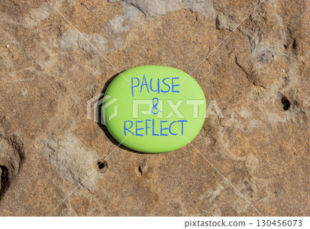 Pause and reflect symbol. Concept words Pause and reflect on beautiful green stone. Beautiful brown stone background. Business motivational lifestyle pause and reflect concept. Copy space. 130456073
