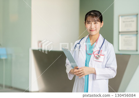Young female doctor working in hospital Young female doctor working in hospital 130456084