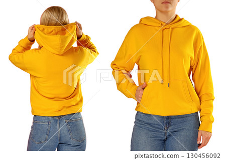 Young woman models a vibrant yellow hoodie style, on white background Young woman models a vibrant yellow hoodie style, on white background 130456092