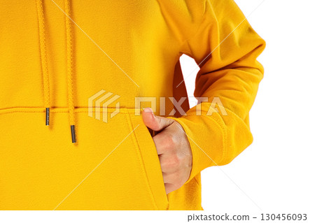 Person in a bright yellow hoodie, on white background 130456093