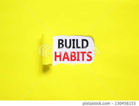 Build habits symbol. Concept word Build habits on beautiful white paper. Beautiful yellow paper background. Business build habits concept. Copy space. Build habits symbol. Concept word Build habits on beautiful white paper. Beautiful yellow paper background. Business build habits concept. Copy space. 130456153