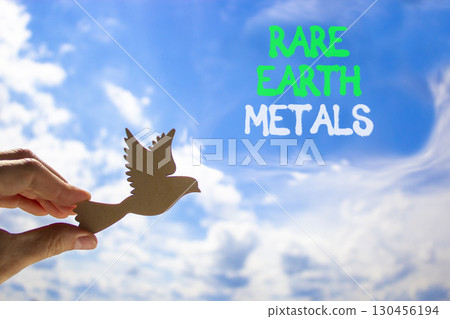 Pause and reflect symbol. Concept words Pause and reflect. Beautiful blue sky clouds background. Businessman hand, wooden birds. Business motivational lifestyle pause and reflect concept. Copy space. 130456194