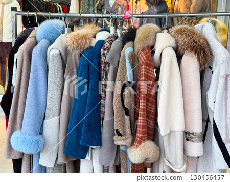 Fur coats hanging on rack in boutique. Fashion apparel, winter clothing and luxury textile for retail shopping, style trend and seasonal wardrobe collection. Fur coats hanging on rack in boutique. Fashion apparel, winter clothing and luxury textile for retail shopping, style trend and seasonal wardrobe collection. 130456457