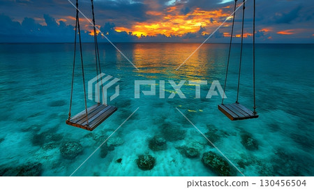 Serene Tropical Seascape with Swings at Sunset 130456504