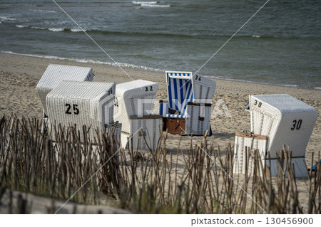 Sylt Island Sunbeds Strandkorbe Outsun on the sandy beach 130456900