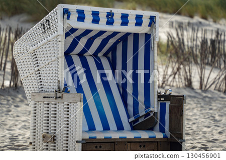 Sylt Island Sunbed detail Strandkorbe Outsun on the sandy beach 130456901