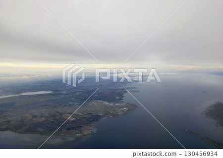 Copenhagen aerial view panorama from airplane window after taking off from airport Copenhagen aerial view panorama from airplane window after taking off from airport 130456934