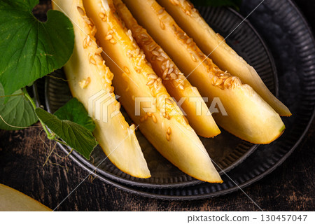 Fresh sweet ripe juicy sliced melon Fresh sweet ripe juicy sliced melon 130457047