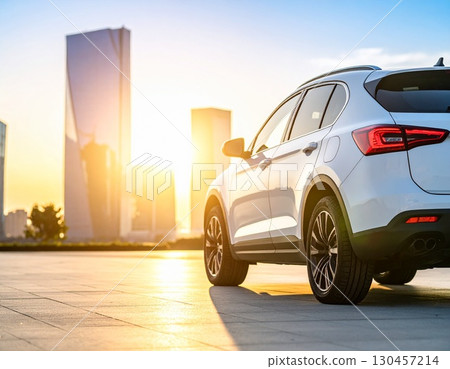 A car running in the setting sun 130457214