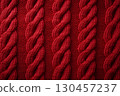 Red knitted winter sweater Background, red texture 130457237