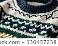 Knitted beige blue green sweater with spike-shaped pattern and line 130457238