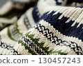 Knitted beige blue green sweater with spike-shaped pattern and line 130457243