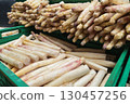 Boxes of fresh green asparagus for sale at a market. Agricultural business. 130457256