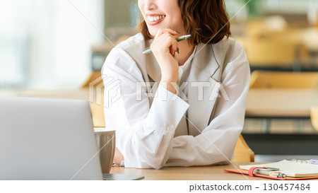 Woman doing desk work / business woman Woman doing desk work / business woman 130457484