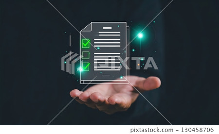 Digital checklist and document verification floating above hand with glowing checkmarks and futuristic interface, high tech online form in a virtual setting 130458706