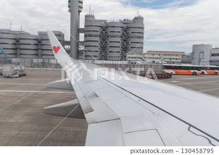 Airplane wing running on the runway Airplane wing running on the runway 130458795
