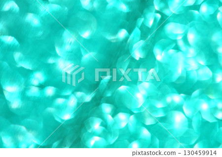 Abstract turquoise bokeh lights pattern with soft circular shapes on blurred 130459914