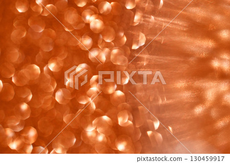 Abstract orange bokeh pattern with circles of light and soft textured background Abstract orange bokeh pattern with circles of light and soft textured background 130459917