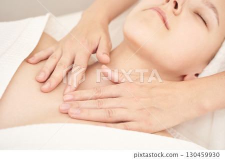 Relaxing spa massage for young caucasian female with calming atmosphere Relaxing spa massage for young caucasian female with calming atmosphere 130459930