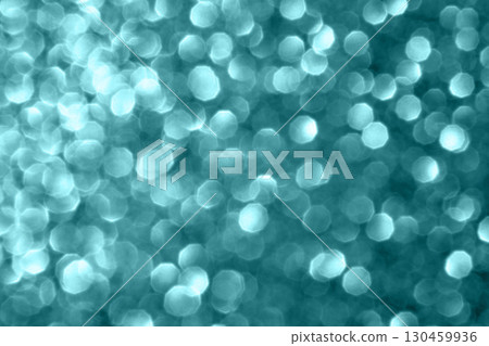 Abstract teal bokeh light pattern creating a dreamy and soft ethereal backdrop 130459936