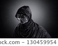 Mysterious humanoid alien at night over dark misty background 130459954